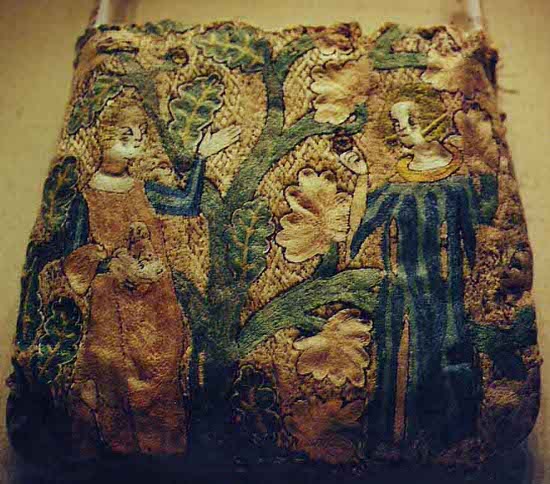 French purse c.1300-1350. split stitch embroidered figures and underside couched background.